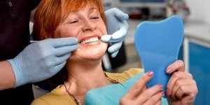 smiling-at-dentist-300x200-min